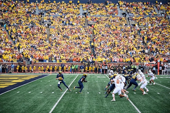 Davis Warren (16) and Michigan Team