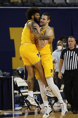 Isaiah Livers (2) and Hunter Dickinson (1)