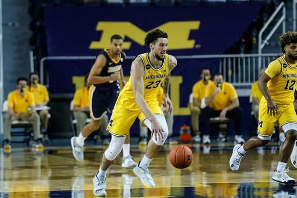 Brandon Johns Jr. (23) and Mike Smith (12)
