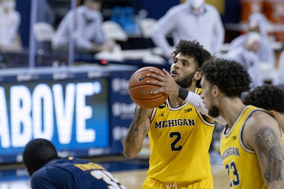 Isaiah Livers (2) and Brandon Johns Jr. (23)