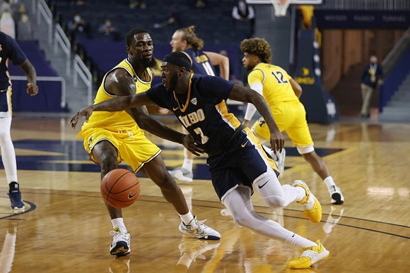 Chaundee Brown Jr. (15) and Mike Smith (12)