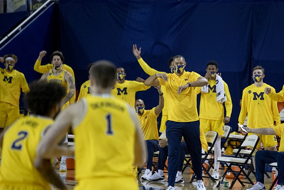 Isaiah Livers (2), Hunter Dickinson (1), and Juwan Howard