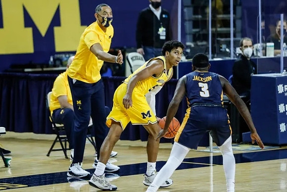 Juwan Howard and Eli Brooks (55)