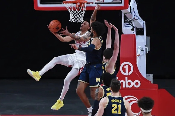 Isaiah Livers (2), Hunter Dickinson (1), and Franz Wagner (21)