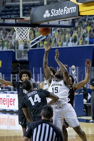 Chaundee Brown Jr. (15) and Isaiah Livers (2)