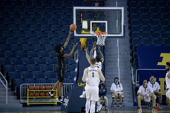 Chaundee Brown Jr. (15) and Hunter Dickinson (1)