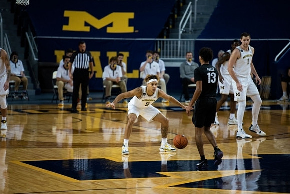 Terrance Williams II (5), Chaundee Brown Jr. (15), and Hunter Dickinson (1)