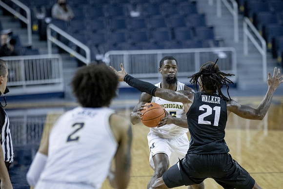 Isaiah Livers (2) and Chaundee Brown Jr. (15)