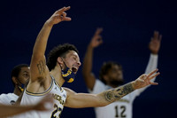 Rico Ozuna-Harrison (14), Brandon Johns Jr. (23), and Mike Smith (12)