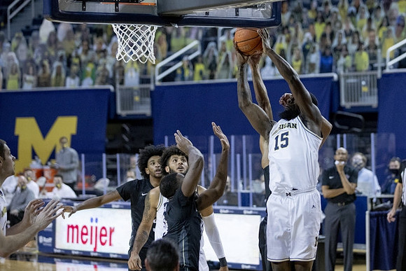 Chaundee Brown Jr. (15) and Isaiah Livers (2)