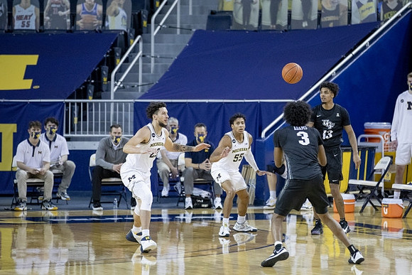 Brandon Johns Jr. (23) and Eli Brooks (55)
