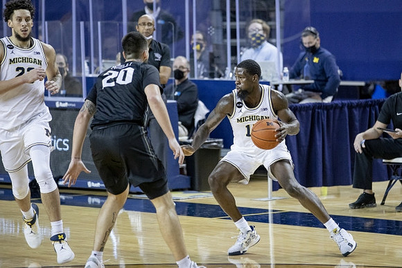 Chaundee Brown Jr. (15) and Brandon Johns Jr. (23)