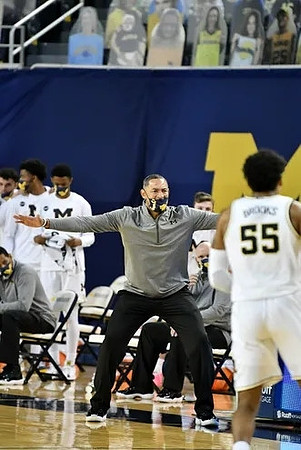 Eli Brooks (55) and Juwan Howard
