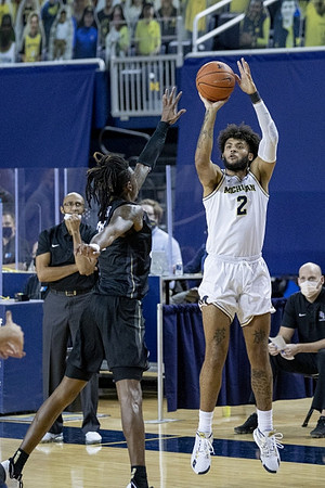 Central Florida Head Coach Johnny Dawkins and Isaiah Livers (2)