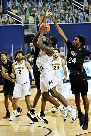 Isaiah Livers (2), Chaundee Brown Jr. (15), and Brandon Johns Jr. (23)
