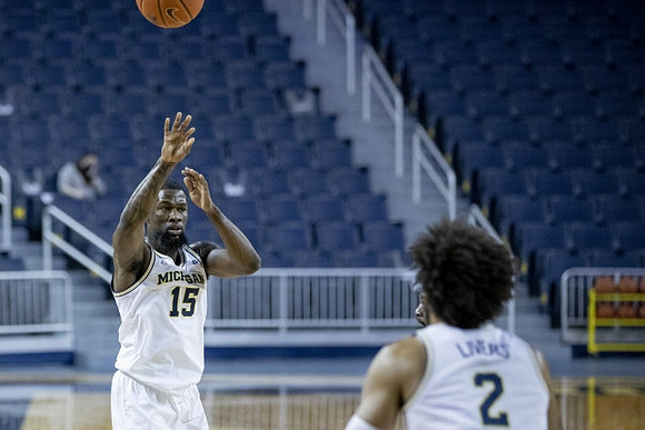 Chaundee Brown Jr. (15) and Isaiah Livers (2)