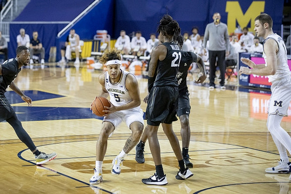 Terrance Williams II (5) and Hunter Dickinson (1)