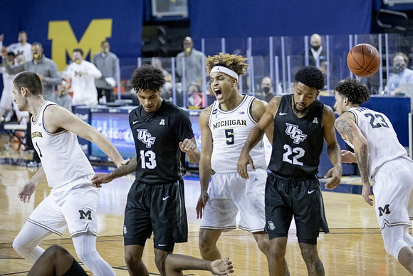 Hunter Dickinson (1), Terrance Williams II (5), and Brandon Johns Jr. (23)