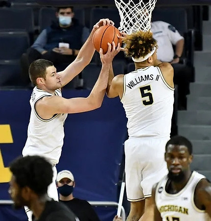 Hunter Dickinson (1), Terrance Williams II (5), and Chaundee Brown Jr. (15)