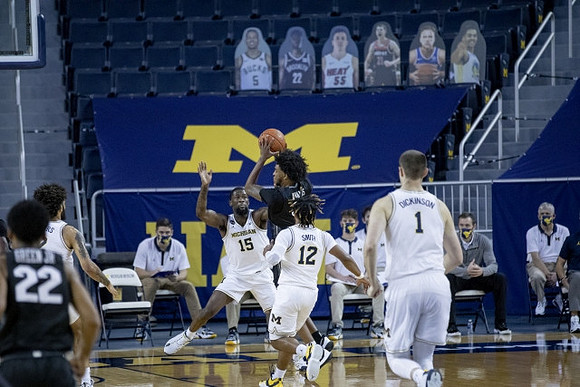 Isaiah Livers (2), Chaundee Brown Jr. (15), Mike Smith (12), and Hunter Dickinson (1)