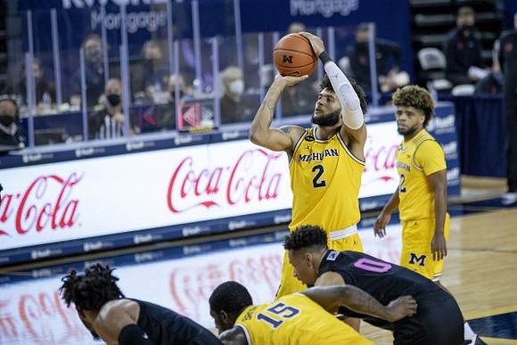 Chaundee Brown Jr. (15), Isaiah Livers (2), and Mike Smith (12)