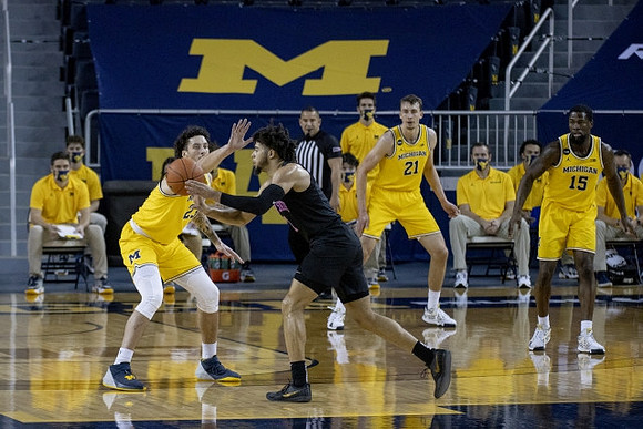 Brandon Johns Jr. (23), Franz Wagner (21), and Chaundee Brown Jr. (15)
