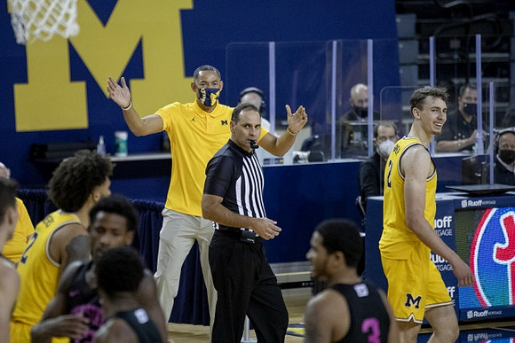 Isaiah Livers (2), Juwan Howard, and Franz Wagner (21)