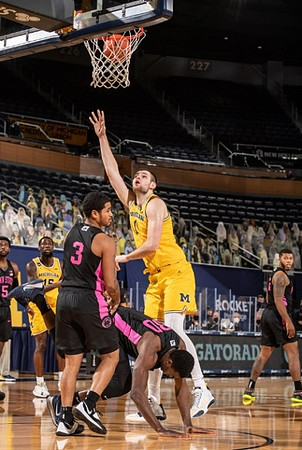 Chaundee Brown Jr. (15) and Hunter Dickinson (1)