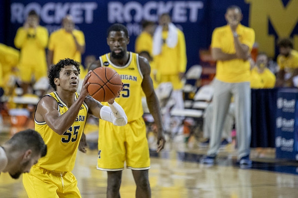 Eli Brooks (55) and Chaundee Brown Jr. (15)
