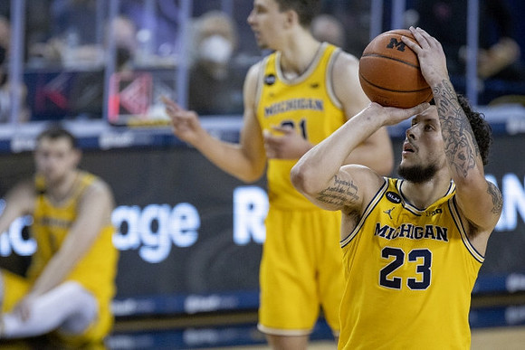 Franz Wagner (21) and Brandon Johns Jr. (23)