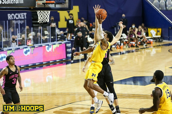 Eli Brooks (55) and Chaundee Brown Jr. (15)
