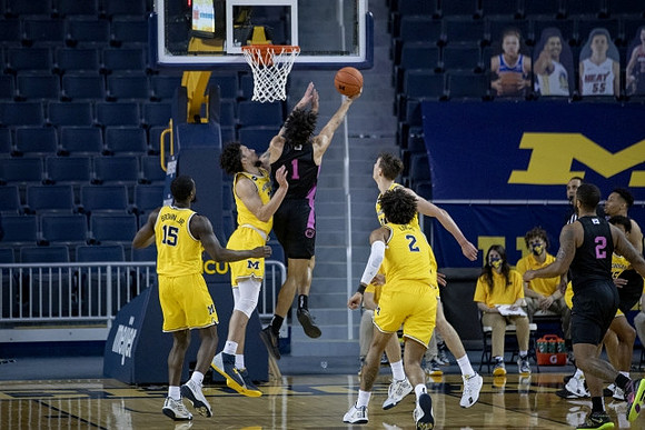 Chaundee Brown Jr. (15), Brandon Johns Jr. (23), Franz Wagner (21), and Isaiah Livers (2)