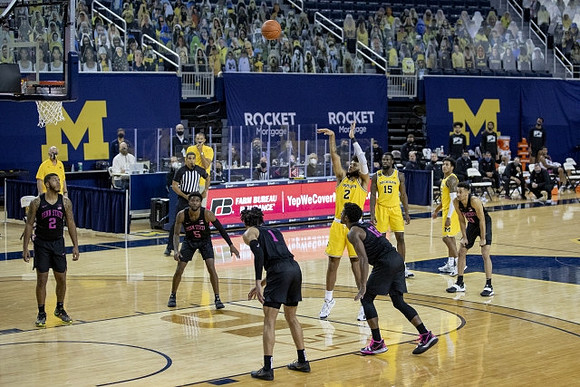 Isaiah Livers (2), Chaundee Brown Jr. (15), and Eli Brooks (55)