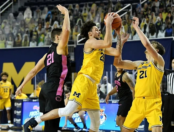 Mike Smith (12), Brandon Johns Jr. (23), and Franz Wagner (21)