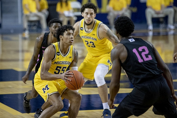 Eli Brooks (55) and Brandon Johns Jr. (23)