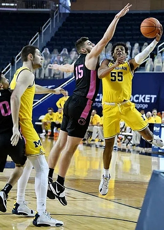 Hunter Dickinson (1) and Eli Brooks (55)