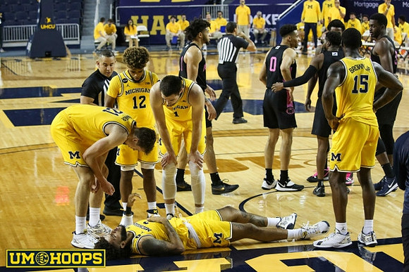 Isaiah Livers (2), Franz Wagner (21), Mike Smith (12), Hunter Dickinson (1), and Chaundee Brown Jr. (15)