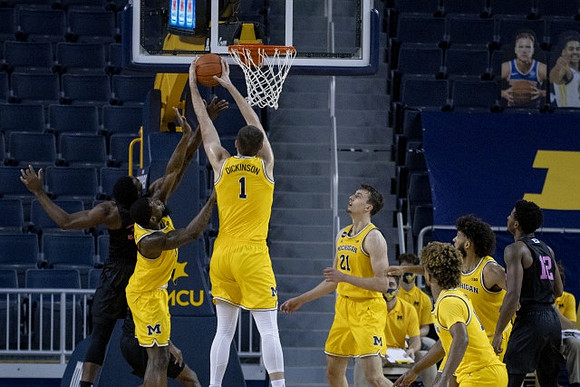 Chaundee Brown Jr. (15), Hunter Dickinson (1), Franz Wagner (21), Mike Smith (12), and Isaiah Livers (2)