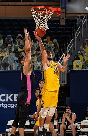 Brandon Johns Jr. (23) and Eli Brooks (55)