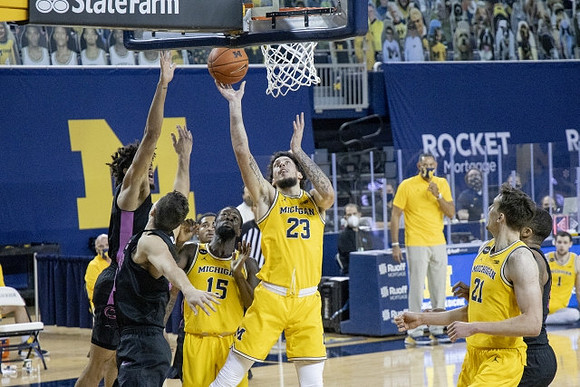 Chaundee Brown Jr. (15), Brandon Johns Jr. (23), and Franz Wagner (21)