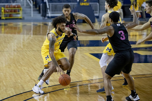 Isaiah Livers (2) and Brandon Johns Jr. (23)