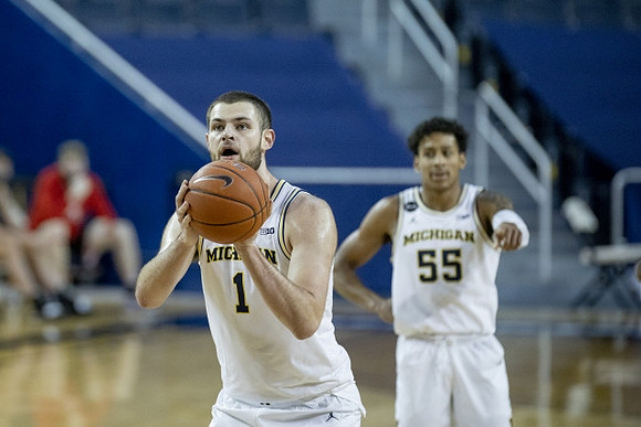 Hunter Dickinson (1) and Eli Brooks (55)