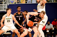 Franz Wagner (21), Hunter Dickinson (1), and Mike Smith (12)