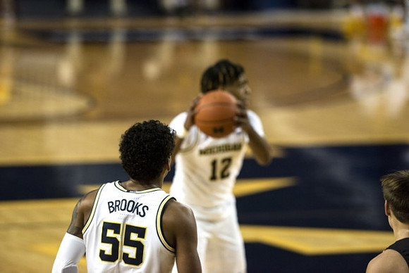 Eli Brooks (55) and Mike Smith (12)