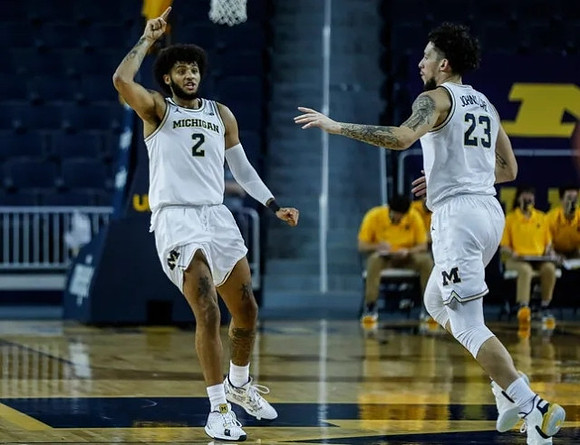 Isaiah Livers (2) and Brandon Johns Jr. (23)