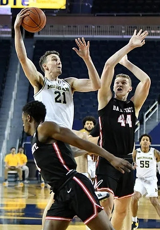 Franz Wagner (21), Isaiah Livers (2), and Eli Brooks (55)