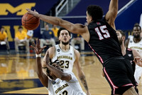 Mike Smith (12), Brandon Johns Jr. (23), and Chaundee Brown Jr. (15)