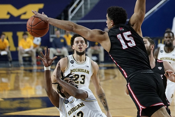 Mike Smith (12), Brandon Johns Jr. (23), and Chaundee Brown Jr. (15)