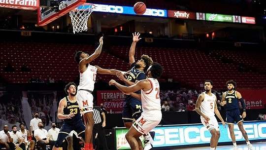 Brandon Johns Jr. (23), Mike Smith (12), and Isaiah Livers (2)