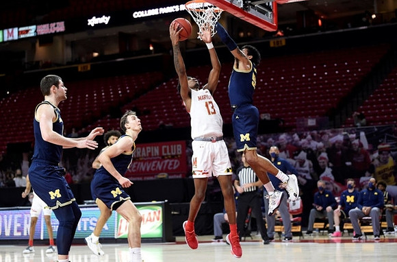 Hunter Dickinson (1), Franz Wagner (21), Isaiah Livers (2), and Eli Brooks (55)